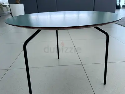 Round minimalist coffee table with slim metal legs
