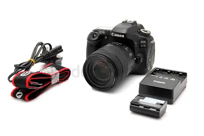 Canon EOS 80D with 18-135mm Lens + Charger  Strap, and more accessories.
