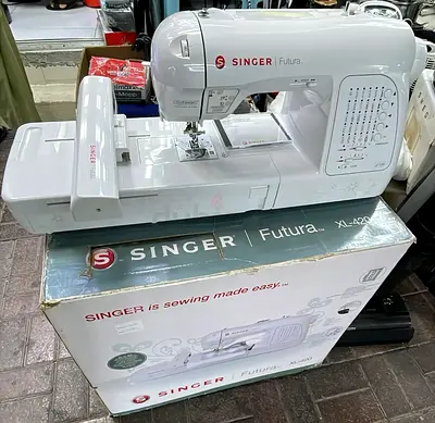 Singer Futura XL-420 is a computerized sewing and embroidery machine designed for intermediate to ad