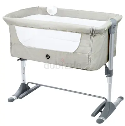 Side-sleeping bedside bassinet / co-sleeper in neutral grey with additional cushion Bed and bedsheet