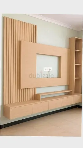 Custom light-wood TV entertainment unit with shelving