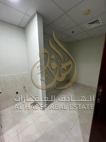 Apartment for annual rent in Al Qasba, 3 bedrooms and a living room with a maid's room, free air conditioning, free parking, contract attestation by t