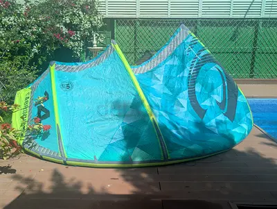 Used Cabrinha 14 Switchblade Kite (bright teal/green) - good condition. No bar.