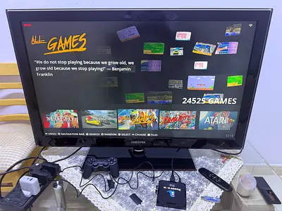 Retro gaming box with DualShock-style controller and 24K+ built-in games