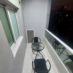 Two-bedroom apartment with a living room, three bathrooms, and two balconies overlooking the creek i