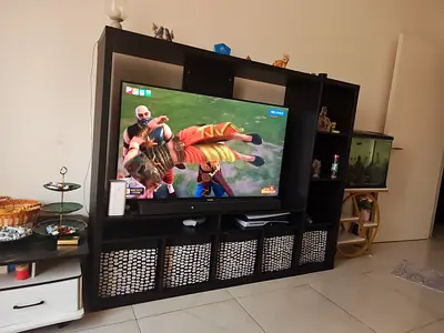 *Urgent sale* Large Black Entertainment/TV Unit with Storage Shelves . I have to exit country.