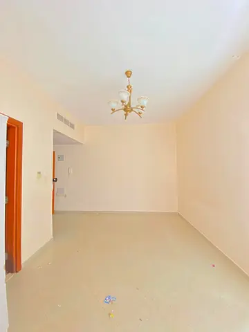 spacious Studio Available with SEPARATE KITCHEN, Wardrobes in just 30k Close to Dubai Border for more details call Mr. Hassan