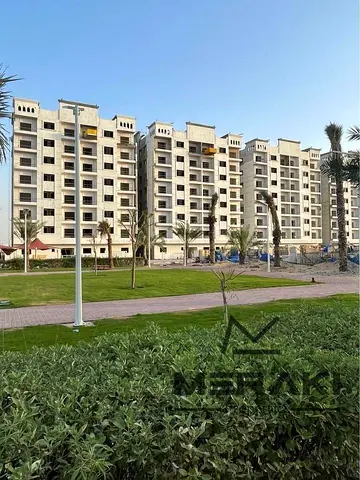 A bedroom and a living room in Al-Amira Village, a prime location on Mohammed Bin Zayed Road, and on top of all that, an amazing price for quick sale