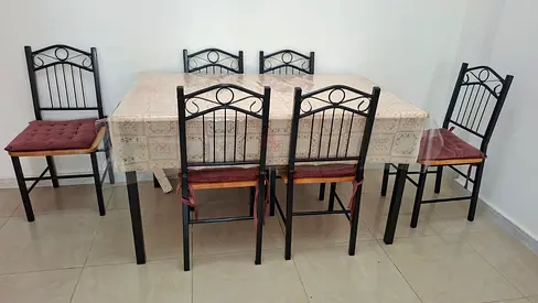 6-Seater Black Metal Dining Table with Cushioned Chairs