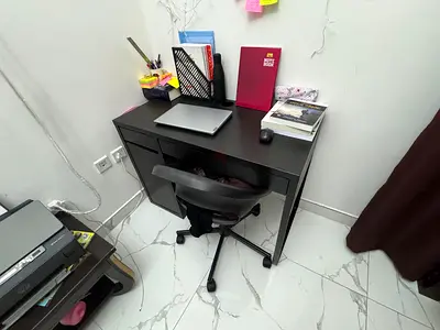 Compact black study desk with drawers — good condition