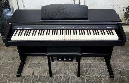 The Roland RP30 is an entry-level, 88-key digital upright piano designed for beginners, featuring
