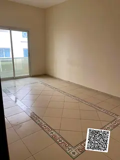📍 Annual Rent in Ajman One bedroom and living room with balcony and separate living room with doo
