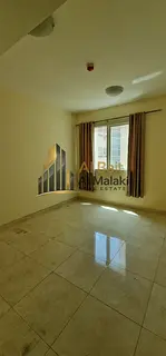 Al Bait Al Malaki Real Estate presents a 2-bedroom hall apartment for rent in Al Taawun – directly