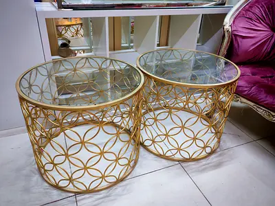 Pair of gold metal and glass round side tables