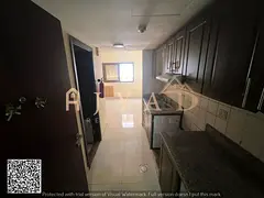 Annual studio for rent in Al Rawda 1 Ajman behind Al Hamidiya Police Central AC built in wardrobes p
