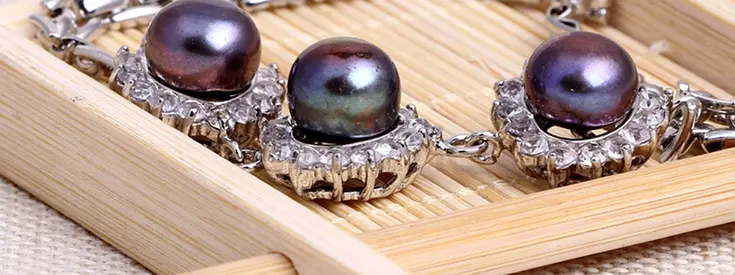 Silver bracelet with black pearls and crystal accents — gently used