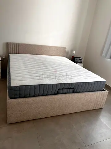 Double bed frame with mattress — beige upholstered