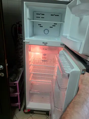 Used top-freezer refrigerator in good working condition