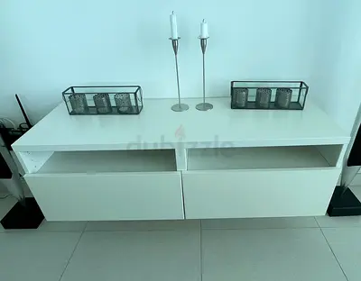 White wall-mounted TV console with drawers