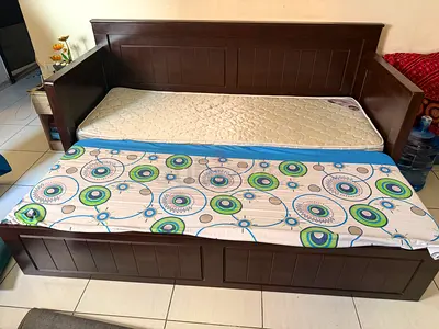 Solid wood sofa cum bed with storage for sale. Good condition, strong frame