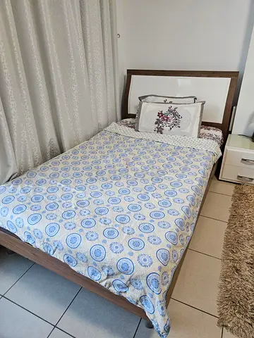 Single wooden bed frame with headboard and bedside drawer - good condition