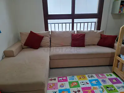 Great catch! A big L-shaped sofa in very good condition for only 600 AED