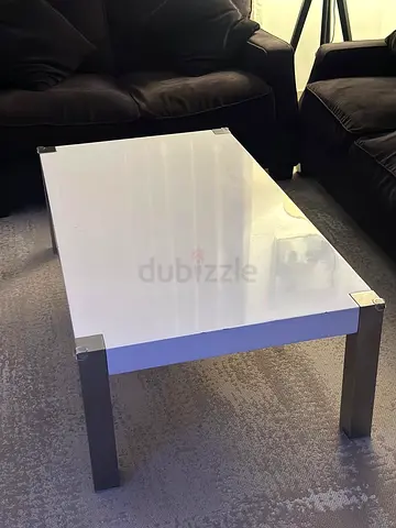 Black 5 seater Sofa with white Modern Coffee Table with Metal Legs.