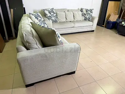 Beige fabric sofa set from Home Centre with a comfortable classic design.
