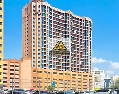 Studio apartment for rent in Al Nuaimiya Towers C with an American-style kitchen and a balcony with