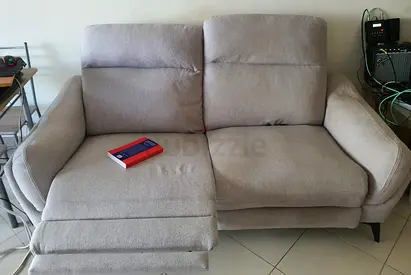 Electrical Light grey 2-seater reclining sofa in good condition
