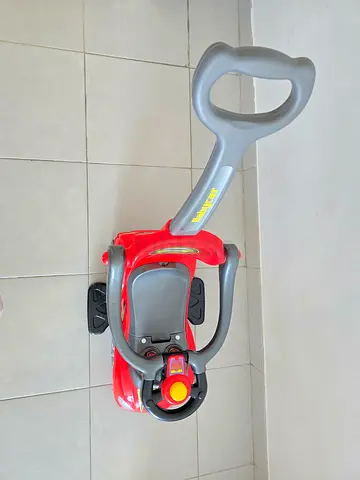Baby push car with parent handle — compact ride-on in good condition