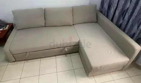 Light beige L-shaped fabric sofa with storage, good condition