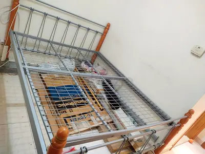 Metal bed frame with wooden posts - single/small double (used)