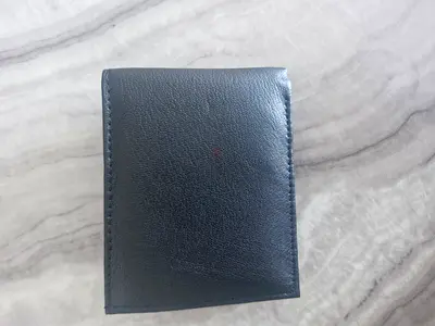 Arrow black leather bi-fold wallet — compact, almost never used.