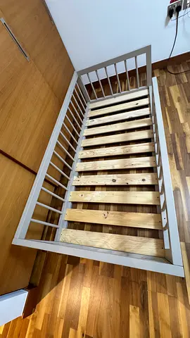 Another Custom made montessori floor bed with round rails. Made from solid wood