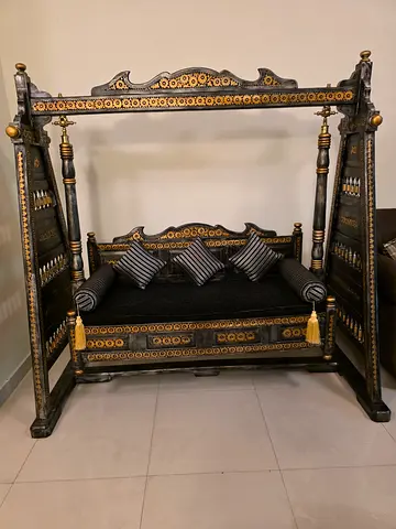Antique-Style Carved Wooden swing with Cushions.