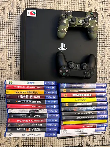 Play station 4 Pro 1TB + 22 games