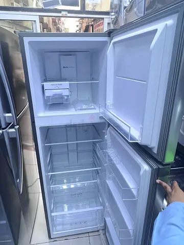 Used double-door refrigerator in good condition (freezer on top)