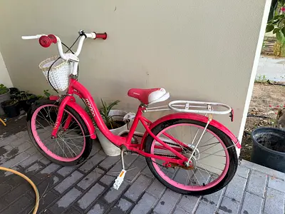 Pink kids bicycle with basket — 20 inch, gently used