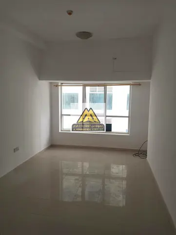 Spacious studio apartment in Pearl Towers, Al Rashidiya 1, featuring a practical layout and a prime