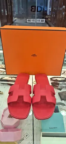 Pink Hermes-style slide sandals (pre-owned)