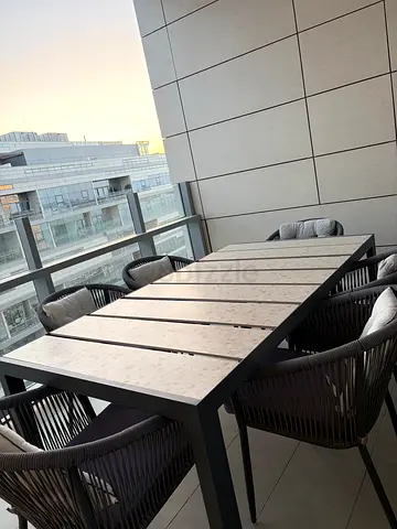 Outdoor dining table set with 6 woven chairs - excellent condition with marble top