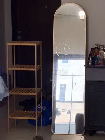 Full-length arched floor mirror with thin gold frame and  Bamboo shelving unit good used condition