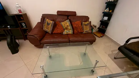 Brown leather 2-seater sofa with headrest - good condition with glass table and Cushions only 150