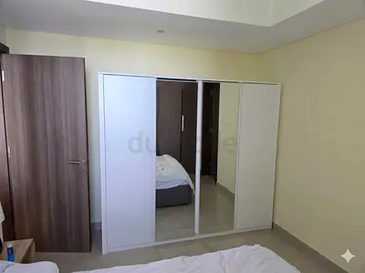 White 4-Door Wardrobe with Full-Length Mirrors - Good Condition