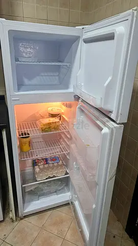 Small white single-door refrigerator with freezer compartment - good working condition