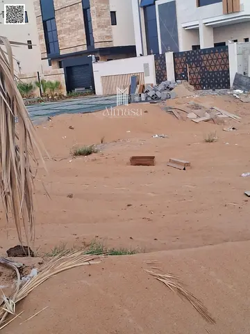 Land for sale at a bargain price, including registration and ownership fees in Al-Haliou