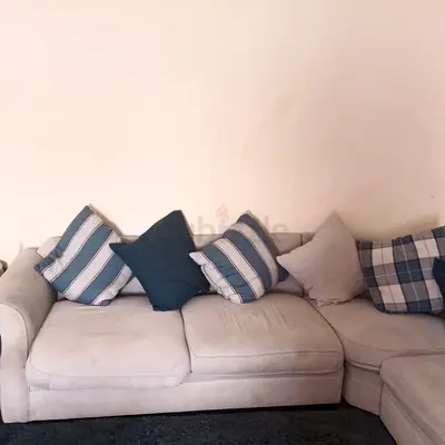 Light grey L-shaped fabric sofa with cushions 5 seat - good condition