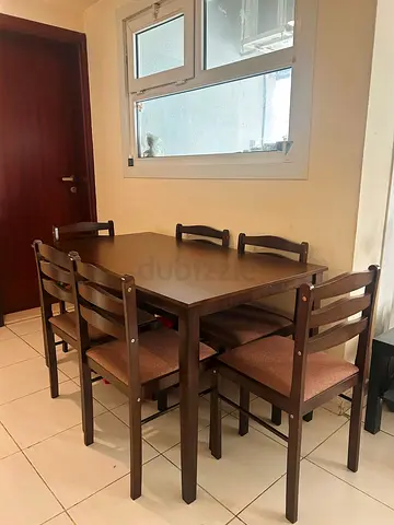 Solid wood 6-seater dining table with chairs - good condition