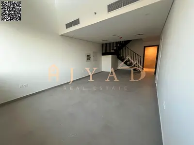 2BR duplex hall for annual rent in Al Helio 2, Ajman. Built-in wardrobes, central AC, 3 baths, hotel finish, near Dubai exit.